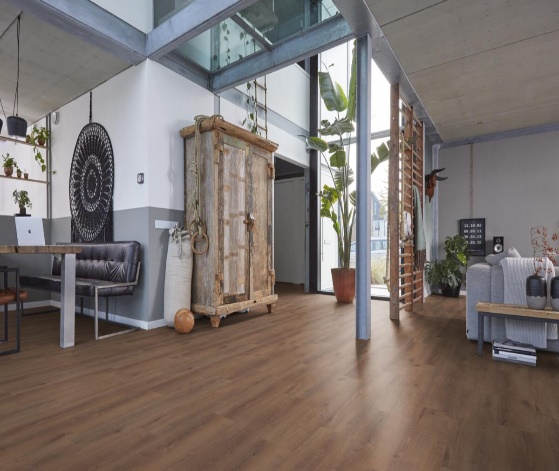 A room with a wood floor and a couch AI-generated content may be incorrect.