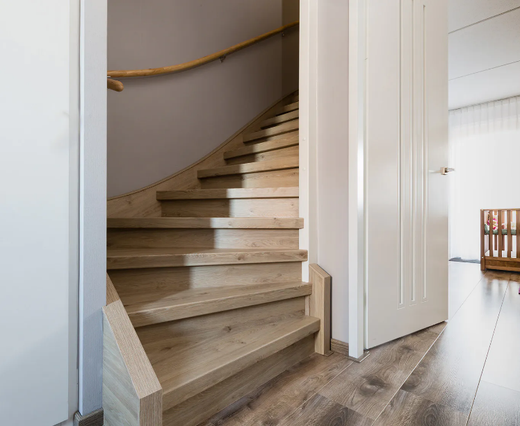 A staircase with a wooden floor AI-generated content may be incorrect.